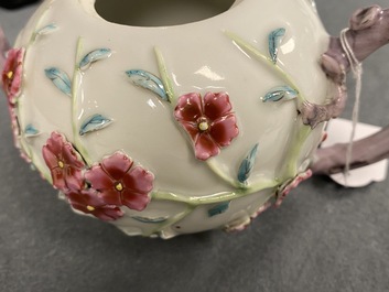 A pair of Chinese famille rose relief-decorated teapots with floral design, Yongzheng